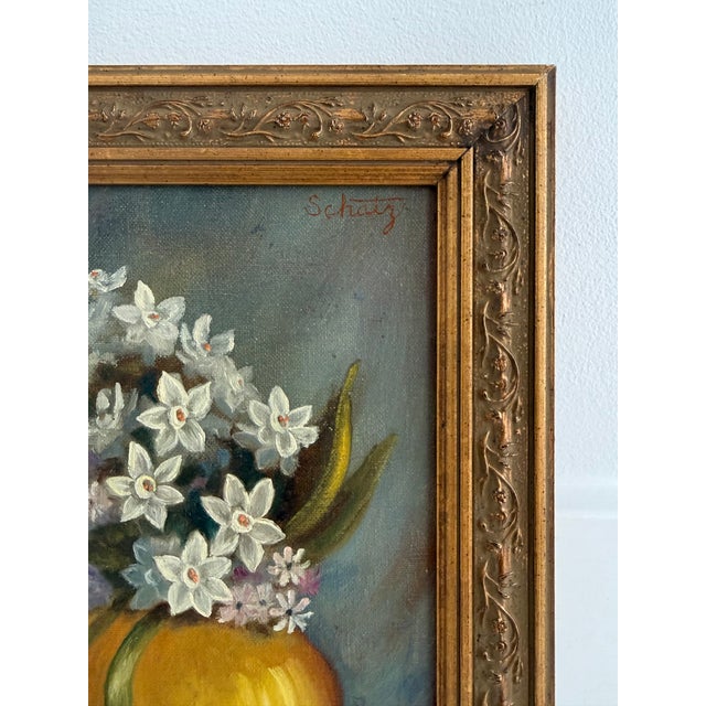 A charming mid-century still life of narcissus and lilac in a golden vase, signed Schatz in upper right. Oil on canvas...