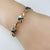 Metal Mid 20th Century 14 Karat Yellow Gold & Black Opal Xo Dolphin Bracelet For Sale - Image 7 of 8