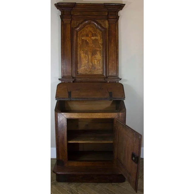 Superb oratory in oak from the Louis XIV period. The lower part forming a drop-leaf desk, has a door with its original...