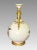 Elegant ivory toned, mat glazed Royal Worcester vase with twin 24 carat gilded stylized dolphin form handles. Depicts pink...