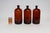 Set of Three Vintage Amber Glass Apothecary Bottles by Owens Illinois Glass Co. For Sale In New York - Image 6 of 18
