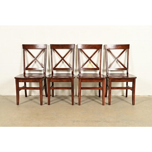 A gorgeous set of four English Country or Farmhouse style walnut X-back dining chairs Circa Late 20th Century Measures:...