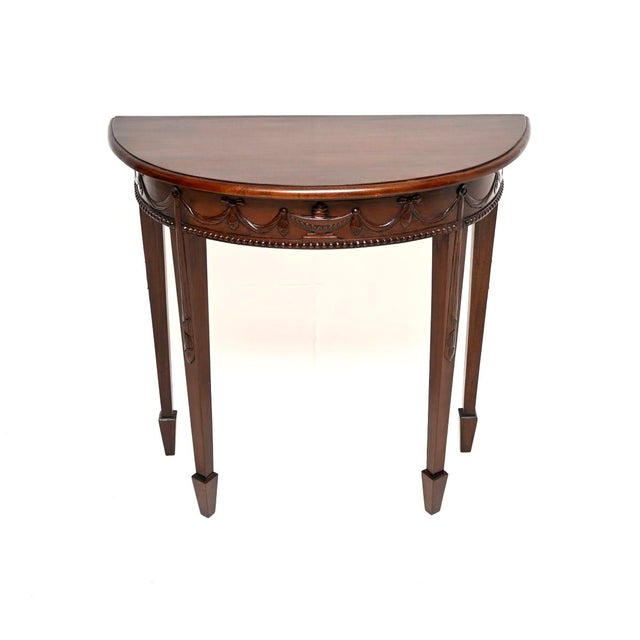 A beautiful and elegant antique Adam style console table. This was made in England, it dates from around the 1950’s. The...