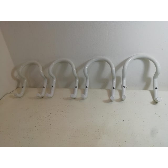 Set of coat hangers for Acerbis designed by Cesare Rota Nodari Curved and enamelled metal. Minimalist and functional...