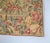 Tapestry with a motif of rich ladies in a garden, having fun digging for treasure. The tapestry is woven using the...