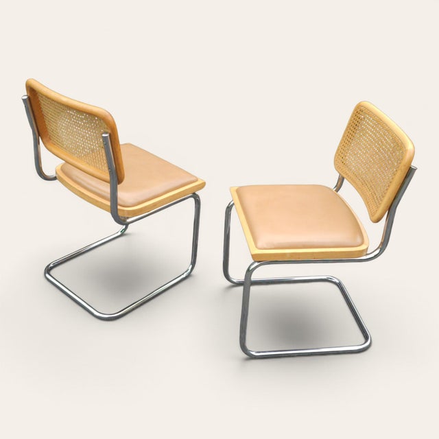 A vintage set of four Cesca dining chairs attributed to Marcel Breuer, featuring woven cane backs, bentwood frames,...