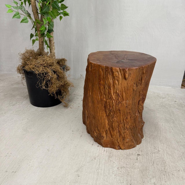 "About This Piece About This Piece Rich and glowing with natural character, this solid wood stump table radiates warmth...