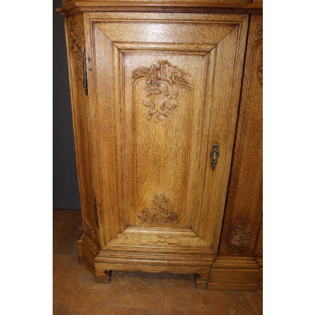 Two Liégeois bodies in light oak, the lower body opens with two doors and two drawers, the upper body is glazed, depth of...