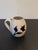 This is a Colonial Williamsburg Pottery creamer from the 70s. It is painted with cobalt blue flowers and leaves and is...