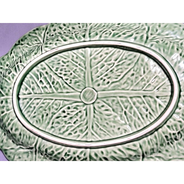 Bring the beauty of Portuguese ceramic artistry to your table with this **Vintage Bordallo Pinheiro Majolica Cabbage Leaf...