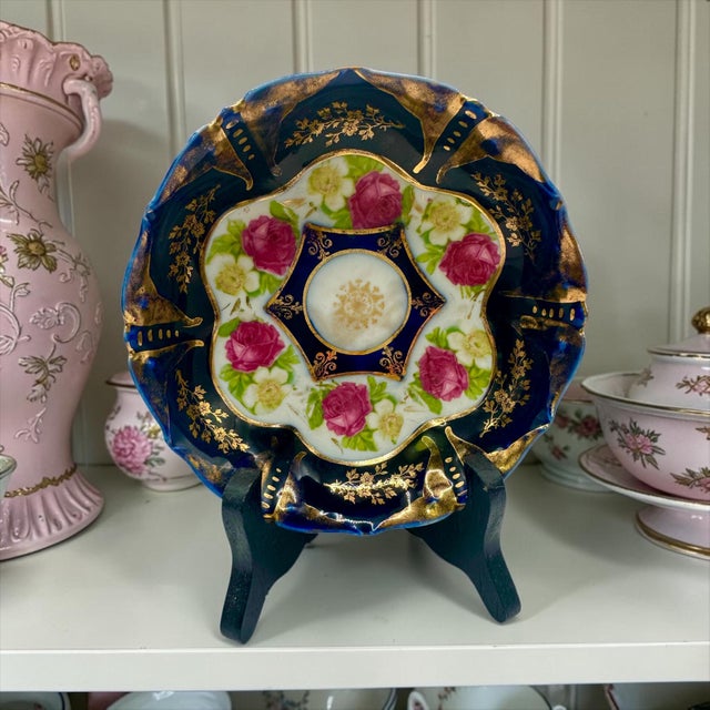 Porcelain Decorative Bowl with Hand-Painted Roses and Cobalt Blue Rim by IPF Germany. This decorative bowl was produced by...