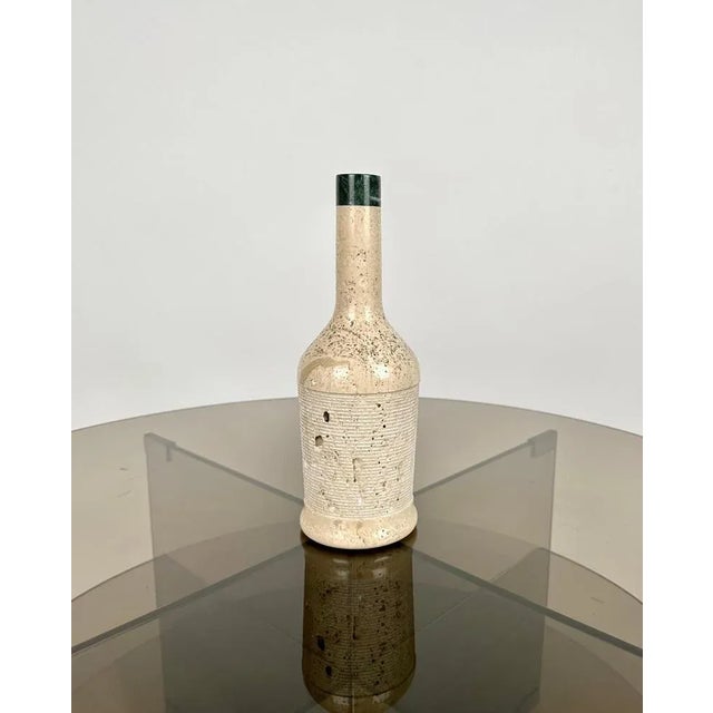 Beautiful bottle shaped sculpture made entirely of travertine marble. Made in Italy in the 1970s.