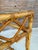 Charming vintage rattan and bamboo coffee table featuring a beautifully woven frame with decorative wrapped joints and a...