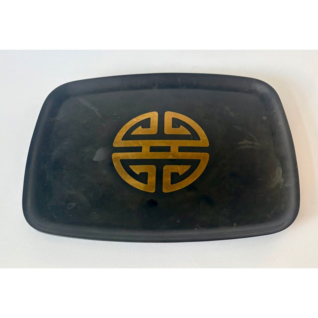 Elevate your mid-century bar cart with this striking vintage cocktail tray from the legendary Couroc of Monterey....