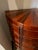 This exceptional vintage demilune console dresser features a striking sunburst inlay top, an elegant bowed front, and a...