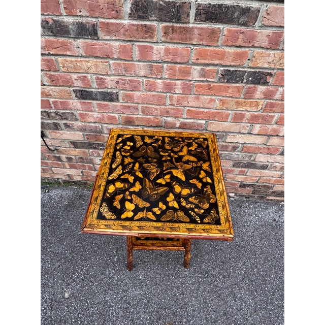 This is a beautifully decoupage English bamboo side table square in shape. The yellow of the butterflies against the black...