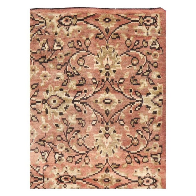 A vintage Turkish Anatolian accent rug in gallery format handmade during the mid-20th century in shades of dusty rose and...