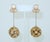 Fashion forward for the 1950's...a pair of Crown Trifari drop dangle earrings consisting of matte gold tone orbs suspended...