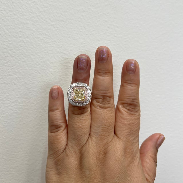 Beautiful 5.09 ct. natural yellow diamond radiant with natural pink and white diamond rounds. Handmade in 18k white and...