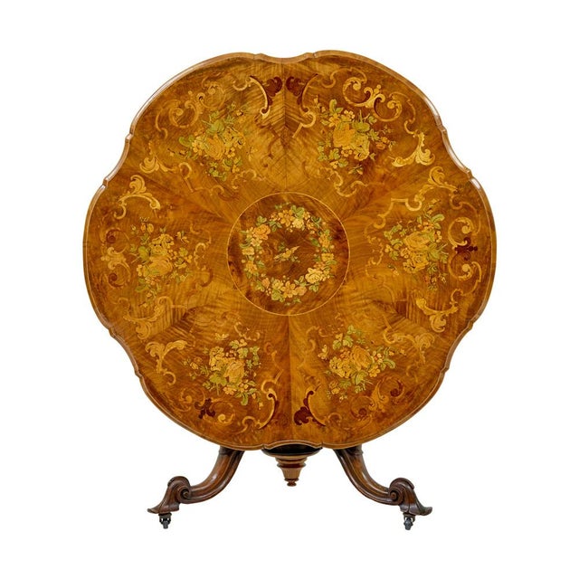 19th century carved walnut center table with inlay circa 1870. We are pleased to offer this stunning center table of...
