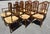 High quality set of 12 classic rush seat walnut chairs with intricate splayed spindle backs and H stretchers. Beautiful...