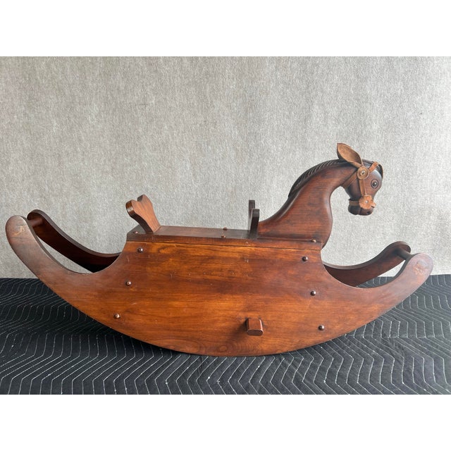 Wonderful, vintage Late 20th Century c1990 rocking horse handcrafted from solid cherry wood with leather ears and harness....