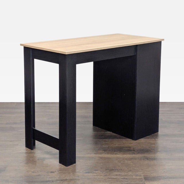 This desk features a stylish two-tone design with a light wood top and black frame. It includes a side cabinet with a...