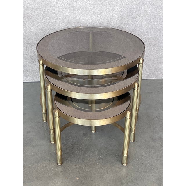 Art Deco Set of Three Round Brass Nesting Tables With Smoked Pink Glass Tops For Sale - Image 3 of 12