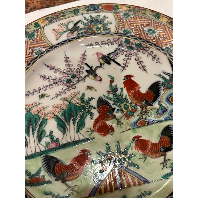 This beautiful plate features an intricate and compelling design with bright roosters, other birds amongst beautiful...