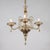 This Murano Chandelier features a translucent golden amber hue designed in the Neo-Rococo style, an interpretation of the...