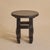 A French Brutalist side table in deeply ebonized wood, crafted in the 1960s. The table has four thick, carved legs curved...