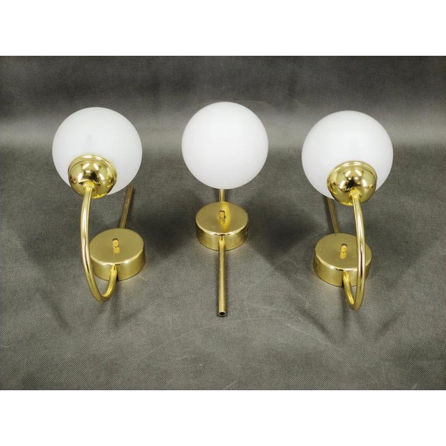 Elegant set of three original wall lights manufactured by kamenický šenov, czechoslovakia, during the 1970s. These...