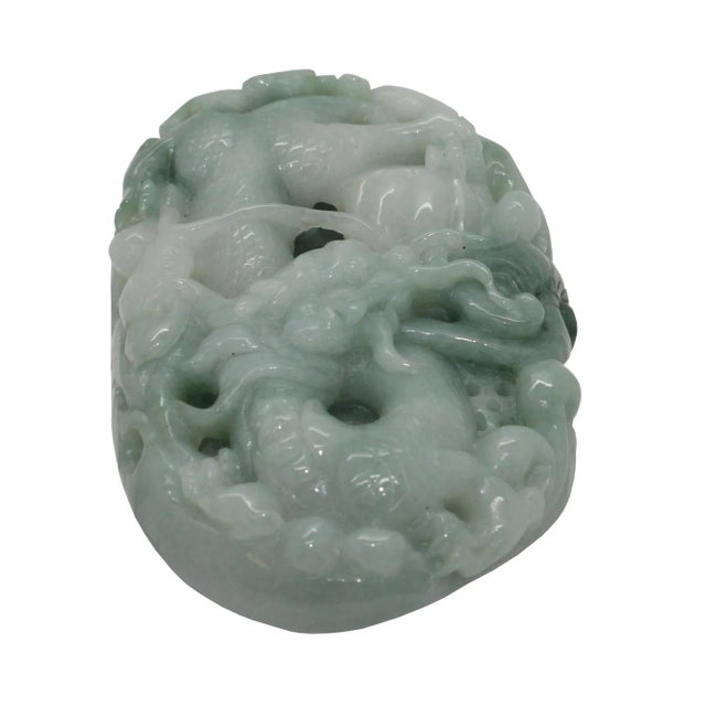 This beautiful belt pendant plate is carved from natural untreated jade, the motif of this pendant is a carved dragon...