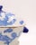 A small English porcelain sauce tureen in the Chinese taste, circa 1900. Rim chips.