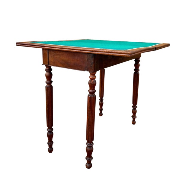 This elegant oak games table dates from the early 20th century and features a classic, understated design. Crafted in...