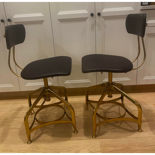 Restoration Hardware 1940’s style vintage Toledo barstools. Bent steel base constructed with a spring loaded clamp and...