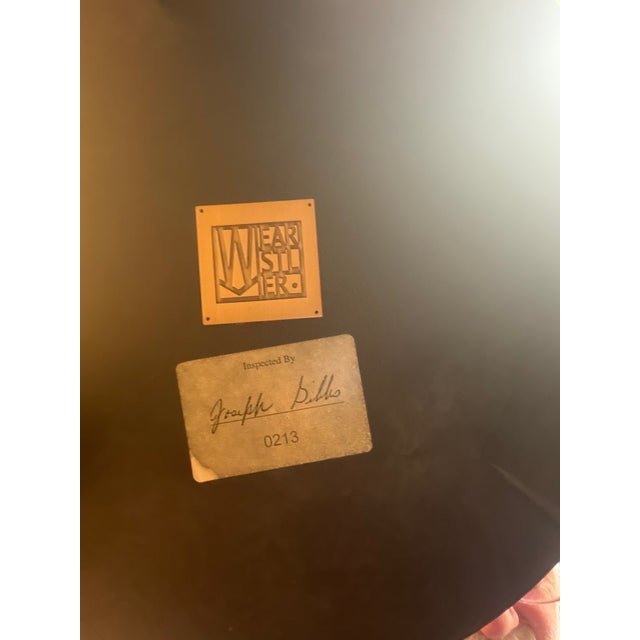 This was bought at the Kelly Wearstler showroom in 2018. It has a black plaster finish with hammered golden bronze legs