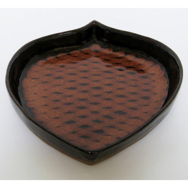 A vintage Niels Frederiksen shallow pottery bowl in the shape of a pine cone. Frederiksen (1917-2005) was a California...