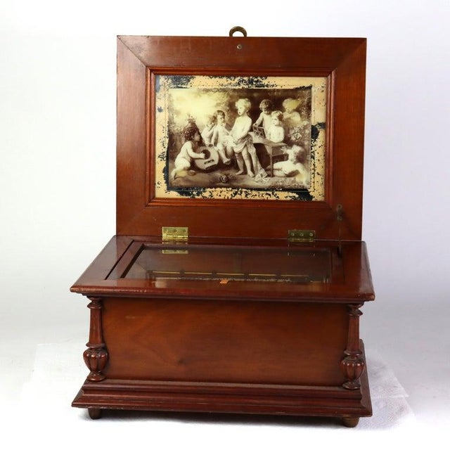 Antique German Shultz Marke Disk Player With 8 Disks C1890 Measures - (10 3/8" x 19 1/4" x 16") An exquisite antique...