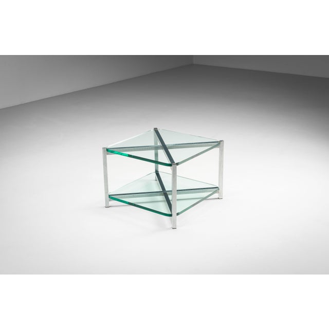 This elegant two-tier glass side table combines minimalist design with practical functionality. Featuring two spacious,...