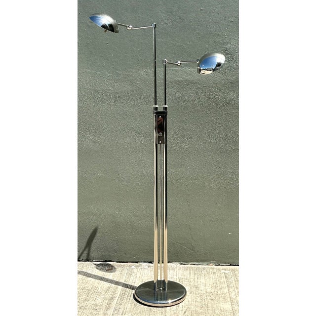 Engineered with German precision and minimalist elegance, this 20th-century floor lamp by Holtkoetter Leuchten features a...