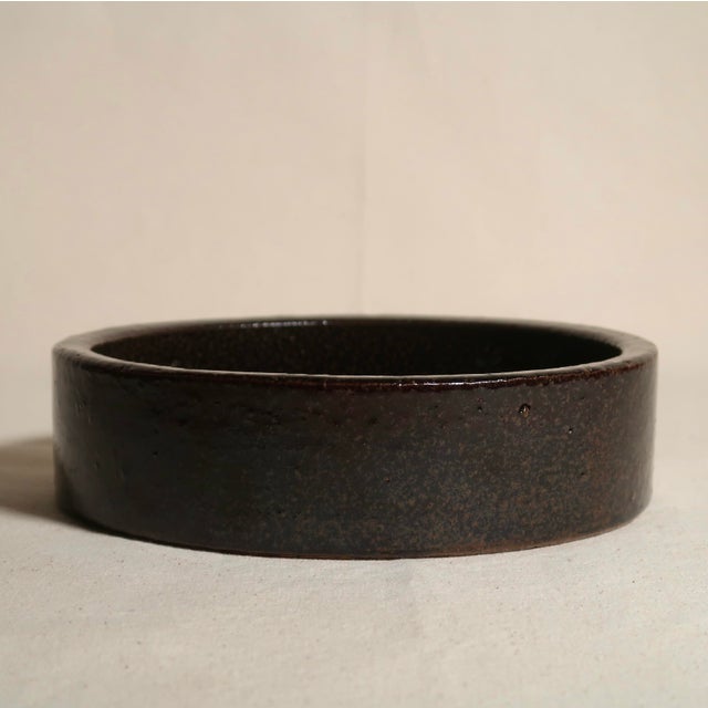 A striking vintage ceramic bowl by Hasle Keramik, crafted on the Danish island of Bornholm, renowned for its mid-century...