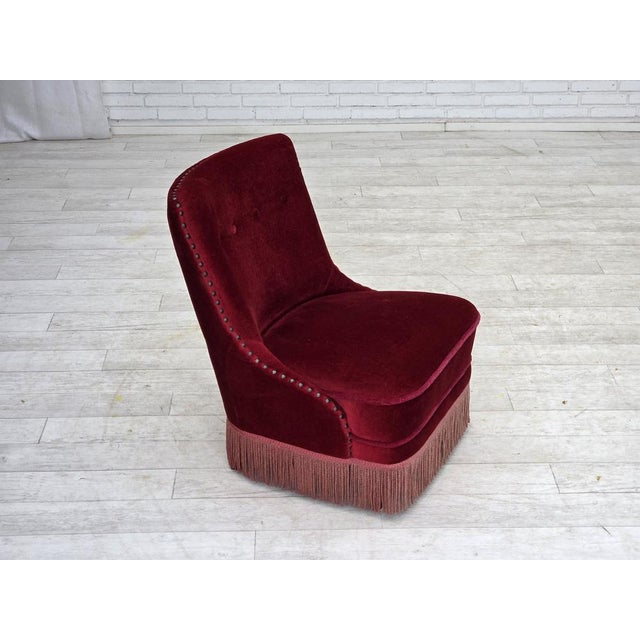 1960s, Danish armchair. Original red furniture velour, beech wood legs, springs in the seat. Original good condition: no...