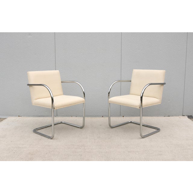 Fabulous pair of Brno tubular chairs in beige and cream cotton/linen blend twill fabric. An icon of modernist classic and...