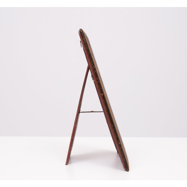 A rare survivor this standing Picture frame. Brown Leather , Gold embossed. Silk insert. Good condition.