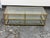 Design Plus Gallery presents the Terrace Coffee Table from West Elm. The rectangular metal frame has an antique brass tone...