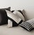 This genuine cowhide throw pillow features abstract geometric cutting, with black, white, and gray colors colliding to...