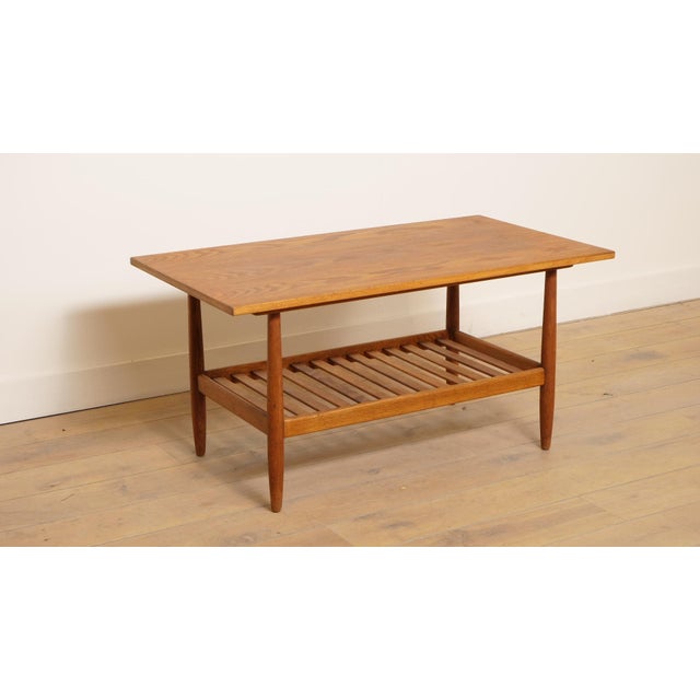 This vintage teak coffee table exudes Scandinavian simplicity, with a timeless design that comes into its own in any room....