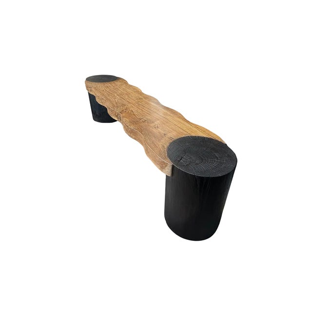 This bench was sculpted from solid teak wood with an elegant mix of contours. The wood used to create this bench is...