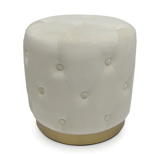 This Zentique glam stool features a round cushioned top in white velvet on splayed metallic gold pin legs. At 17" square,...